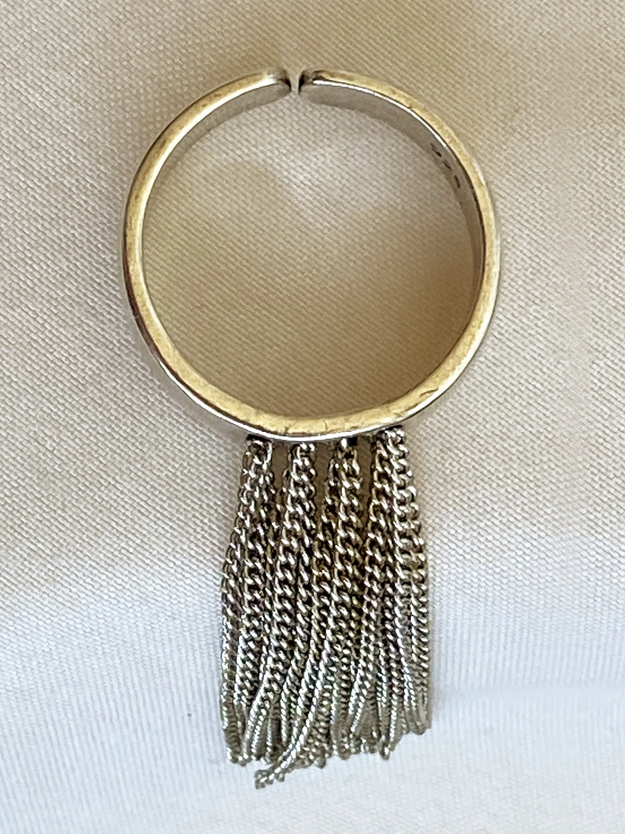 Ring with tassel